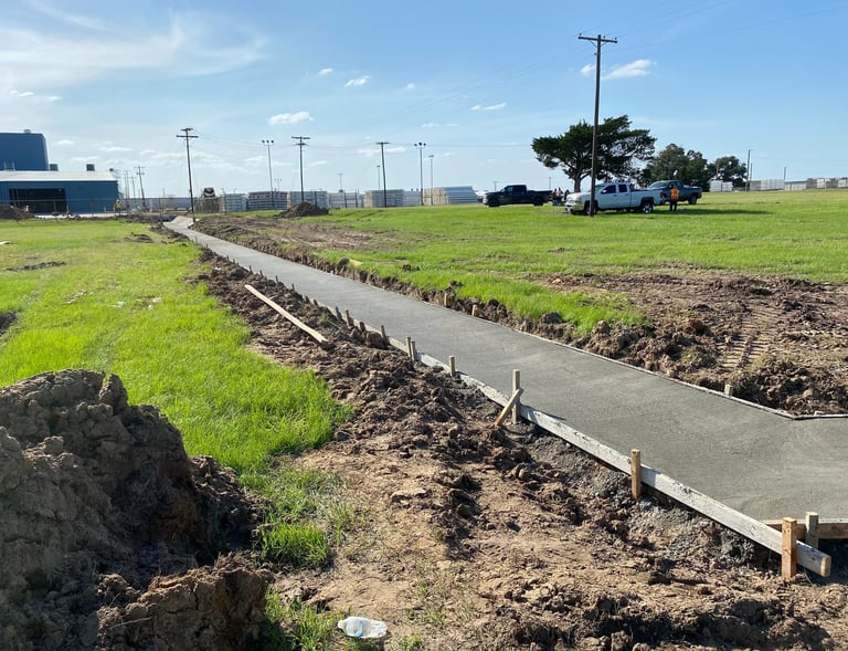 Commercial concrete walkway and flatwork installed by APC
